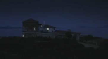 The solitary villa in the peak under night appears to be very dark and ghastly